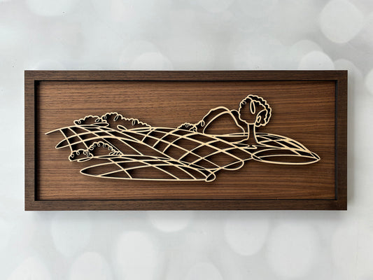 Wooden wall art with a geometric design on a white background